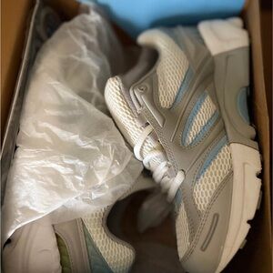 This is an Apex V551 women's athletic shoe in grey and blue